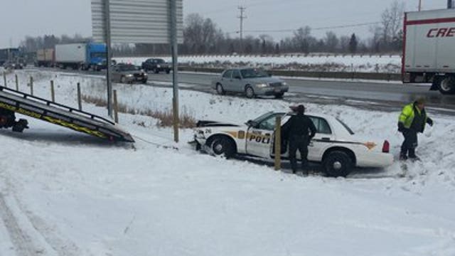 Racine officer hurt after squad is struck, ends up in ditch