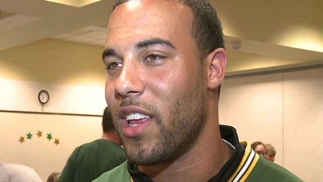 Youngsters SO EXCITED to meet Micah Hyde! Packers cornerback reads to children