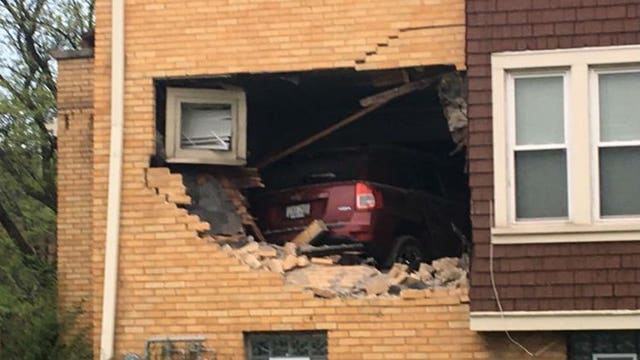 "A truck in my house!" Vehicle goes airborne, slams into building near Capitol and Green Bay