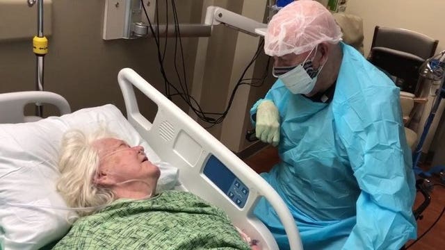 After months apart, 90-year-old Florida man wears full PPE to say goodbye to wife with dementia