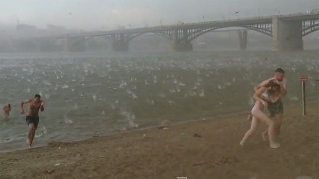 WICKED VIDEO: Sudden hail storm catches beach-goers off guard