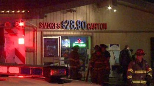 Police investigate liquor and tobacco shop fire