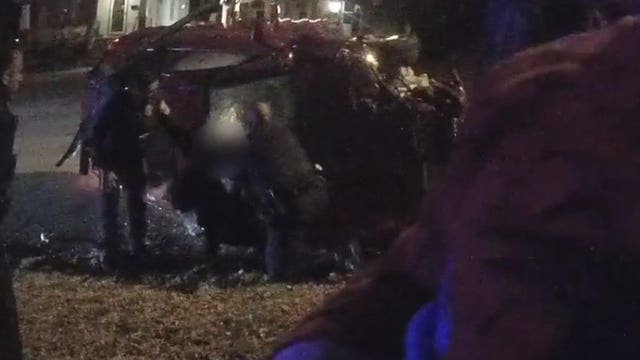 Video: 2 police officers hailed for rescuing mother, child from car after hit-and-run crash