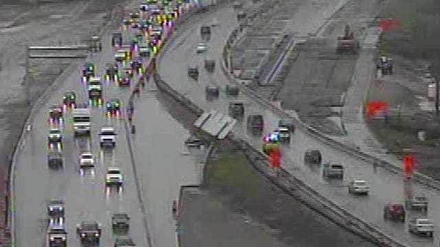 High winds may have caused highway sign to blow into traffic in the Zoo Interchange