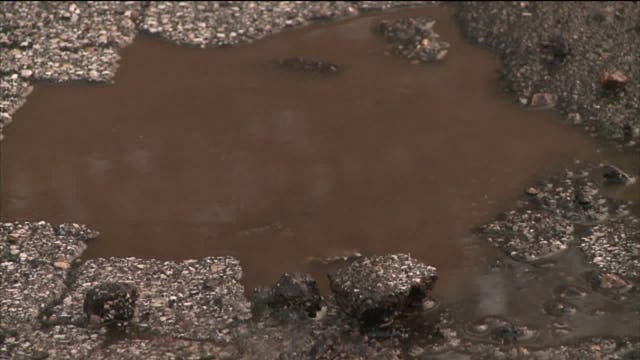 Politics to blame for potholes? That's what some living along Underwood Parkway in Wauwatosa believe
