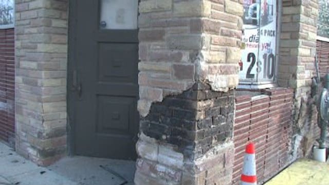 Man killed, woman injured when car slams into grocery store