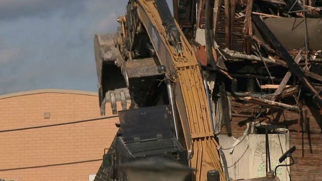 118-year-old building, site of four-alarm fire demolished; building had prior fire safety violations