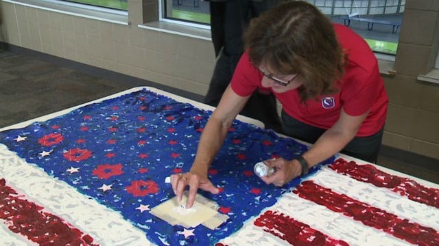 "Unite the country:" Olympic gold medalist joins 'Flag for Hope' project to spread American pride
