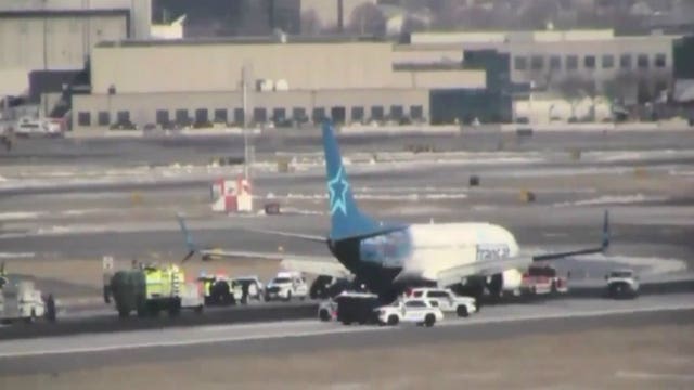 Officials: Report of fire onboard forces plane to make emergency landing at Newark airport