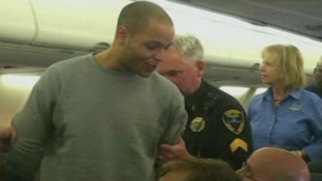 Flight from Chicago diverted after man tries to open door mid-flight
