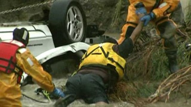 Crews save man from racing currents of Colorado flood