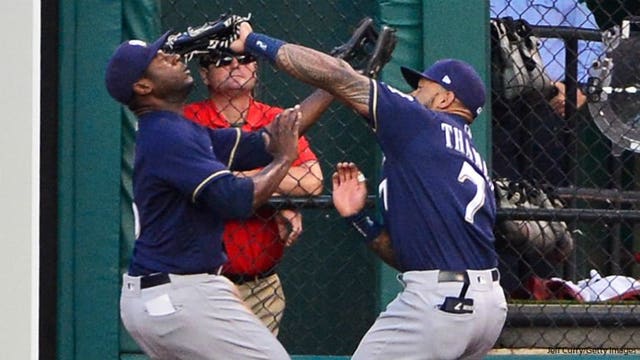 Brewers' Thames exits with sore knee after outfield run-in