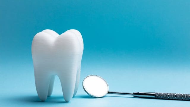 Watch: News anchor catches tooth as it falls out during live broadcast