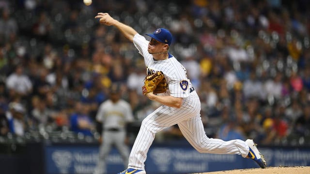 Anderson pitches 6 scoreless, Brewers stretch wild-card lead
