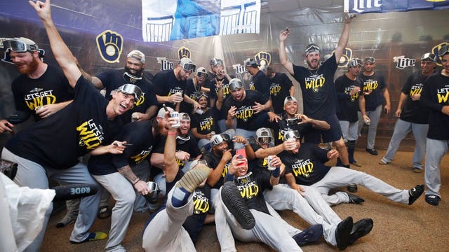 Surging Brewers clinch playoff berth with 9-2 win over Reds