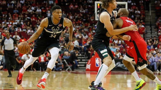 Bucks beat Rockets 117-111 in season opener