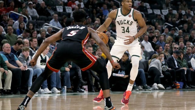 Heat spoil Bucks' home opener, rally to 131-126 win in OT