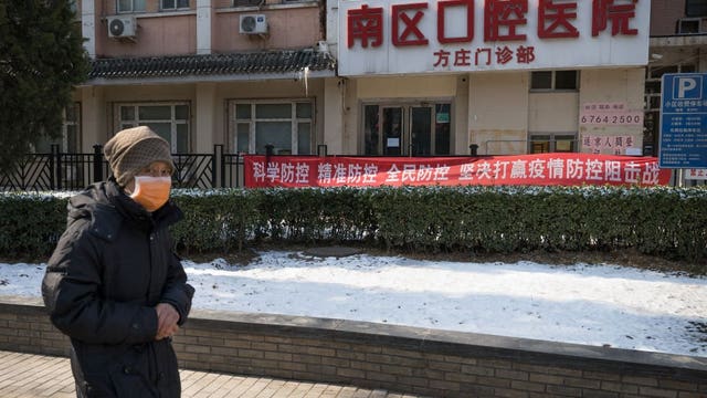 China sees big drop in new virus cases; France reports death