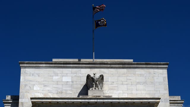 Fed signals it will likely hold rates near zero for months to support economy through 'challenging time'