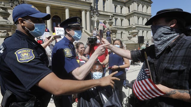 3 barbers ticketed for cutting hair in protest at Michigan Capitol