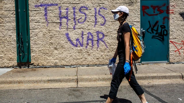 Volunteers clean up trash, graffiti and debris following Twin Cities protests
