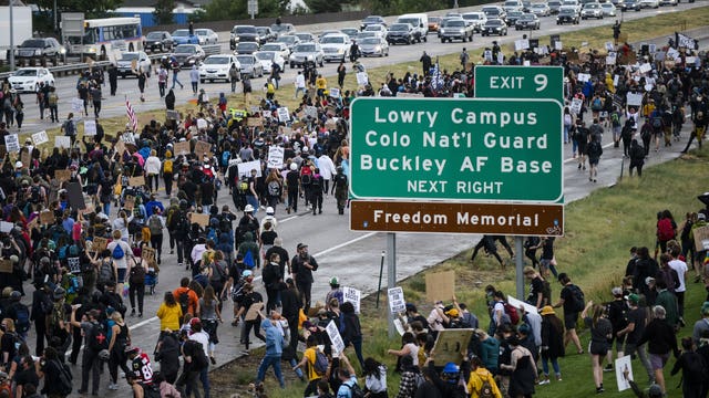 Car drives through crowd, protester shot in Colorado