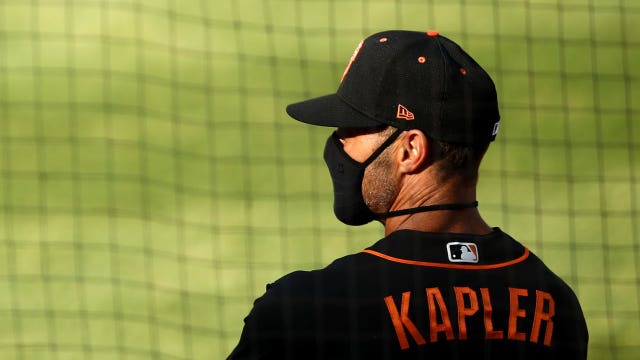 Giants manager Gabe Kapler, players kneel during anthem