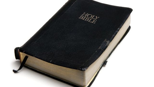 Priest uses squirt gun to shoot holy water and maintain social distancing