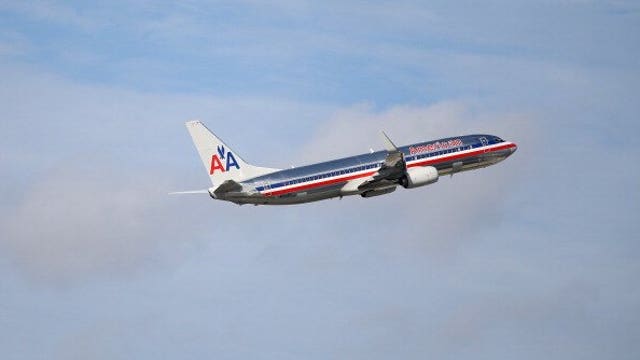 Passenger detained after allegedly trying to break into cockpit of American Airlines flight