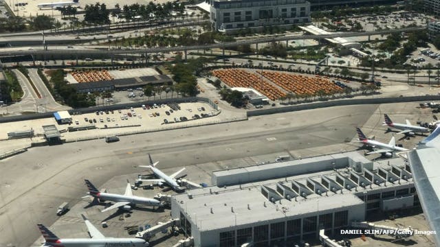 Police shoot armed man at Miami airport amid Irma evacuation