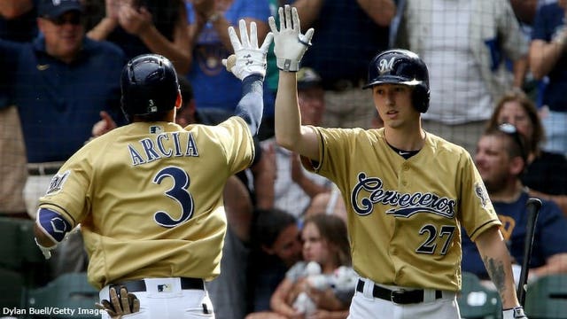 Santana homers off Stanton's glove, Brewers beat Marlins 8-4