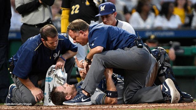 Brewers catcher Vogt out at least a month with sprained knee