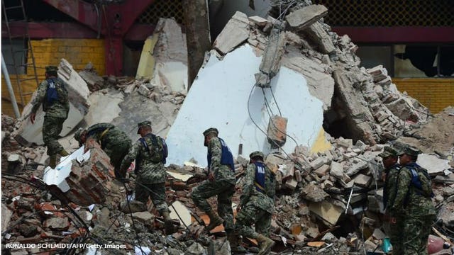 Policeman's body found in Mexico, quake toll 65