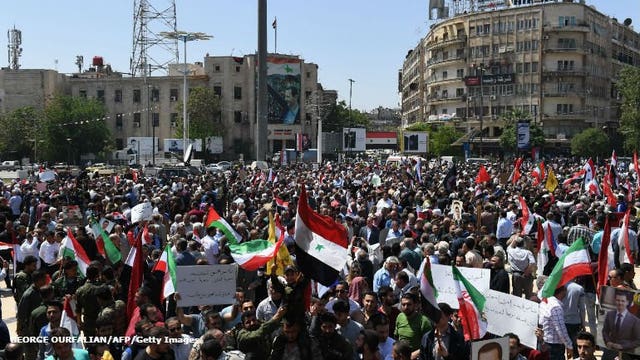 Syrians gather in capital in defiance after airstrikes