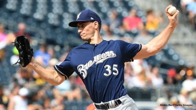 Injured Brewers pitcher Suter told to stay out of dugout