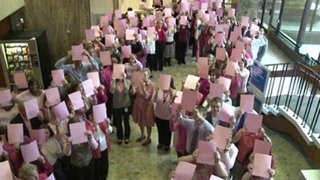 Milwaukee law firm creates human pink ribbon for breast cancer awareness
