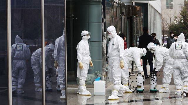 Virus spreads to over 60 countries; France closes the Louvre