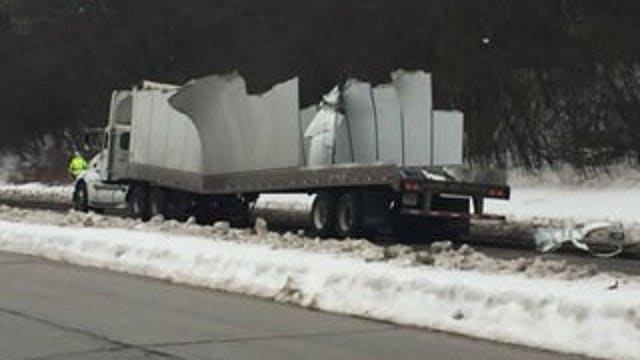 Top of semi trailer smashes into railroad overpass on Swan Boulevard in Wauwatosa
