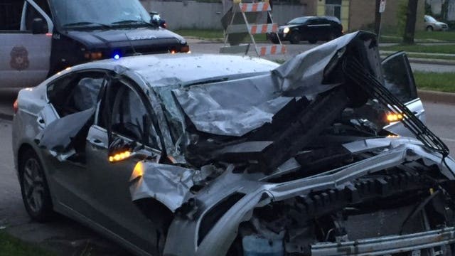 Vehicle taken in carjacking slams into school bus in Milwaukee; suspect fled on foot