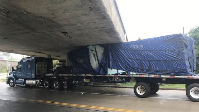 Semi believed to be carrying Styrofoam insulation stuck under I-94 overpass