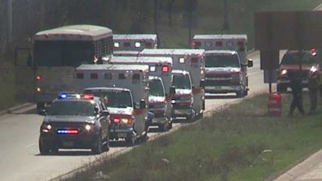 Four inmates taken to hospital after bus clips semi