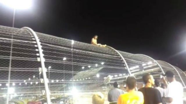 Half-naked NASCAR fan climbs fence at Richmond International Raceway