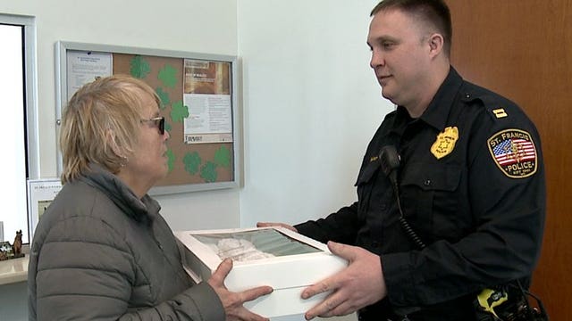 Jen Clark with Jen's Sweet Treats delivers Paczki to police officers