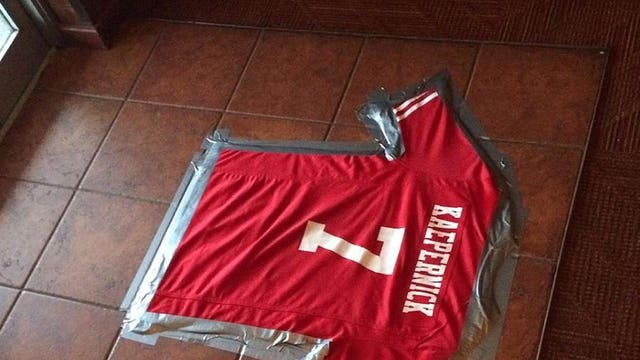 Restaurant tapes Colin Kaepernick jersey to floor as welcome mat