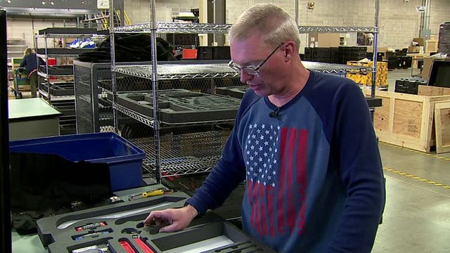 Workers in Menomonee Falls who are visually impaired, pack supply kits for Wisconsin National Guard