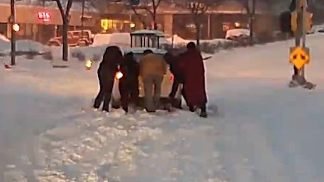 Watch: MCTS driver, passengers rush off bus to help car stuck on railroad tracks