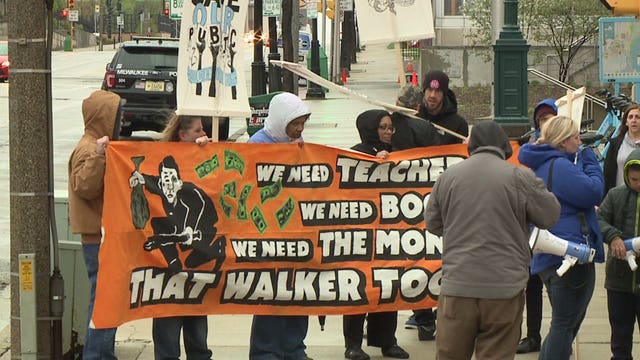 Milwaukee teachers' union members clash with Gov. Walker supporters outside MPM