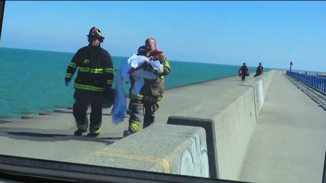 21-year-old woman dies after she and two-year-old boy were pulled from Lake Michigan