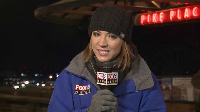 Nicole Koglin talks with football fans, visits Pike Place Fish Market in Seattle