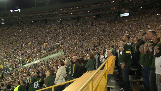 Majority of fans don't lock arms for anthem; Rodgers stands by request saying, "Beauty is, it's a free country"